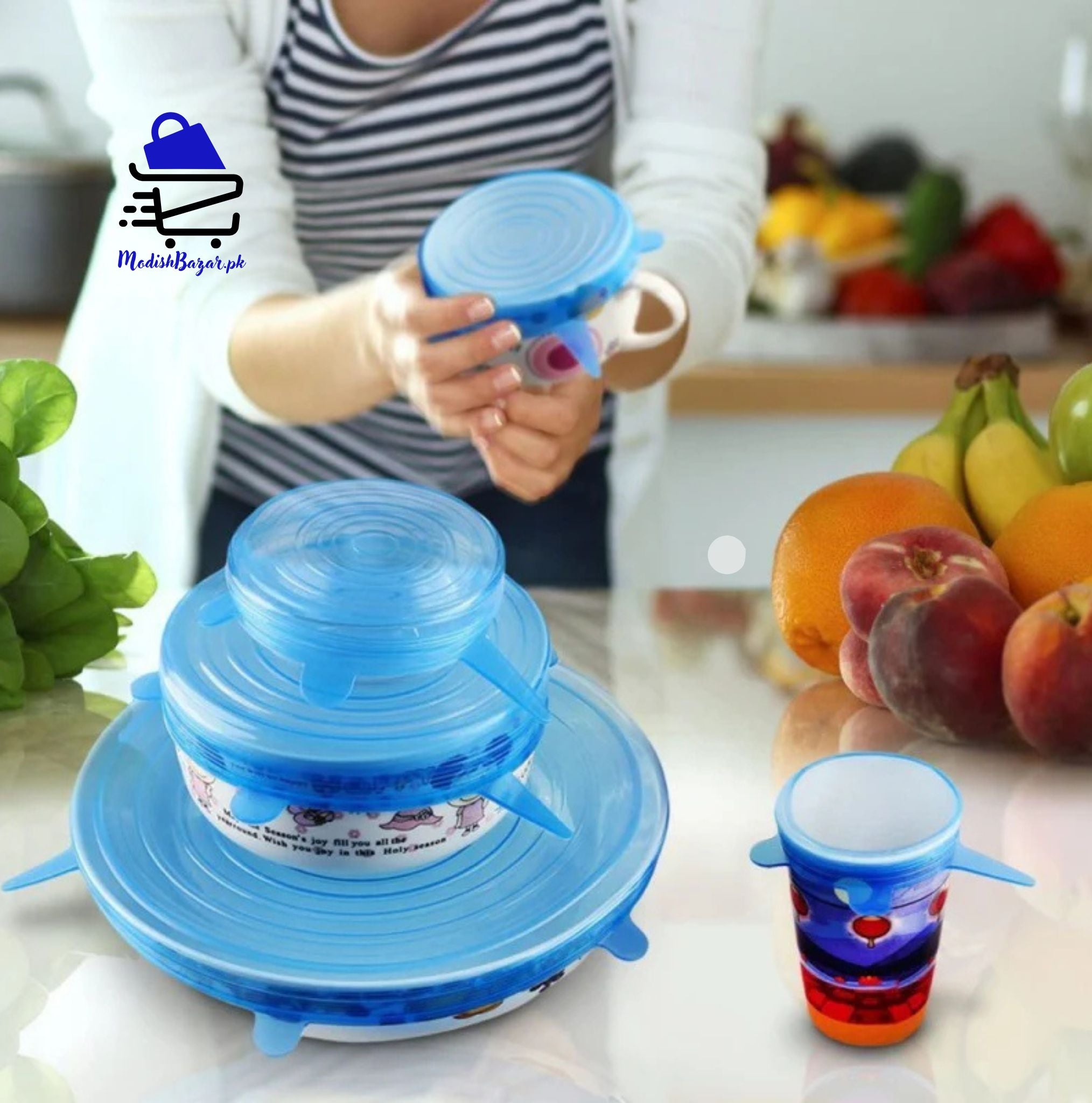 Silicone lids covering bowls, cups, and fruits